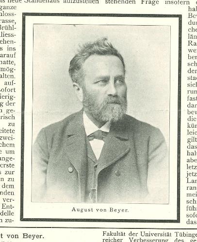 historisches Portraitfoto eines Mannes mit Bart, der Anzug trägt.